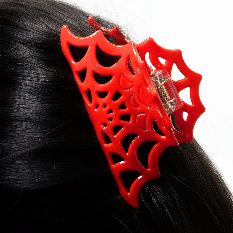 Close-up of the red cobweb design acetate claw clip