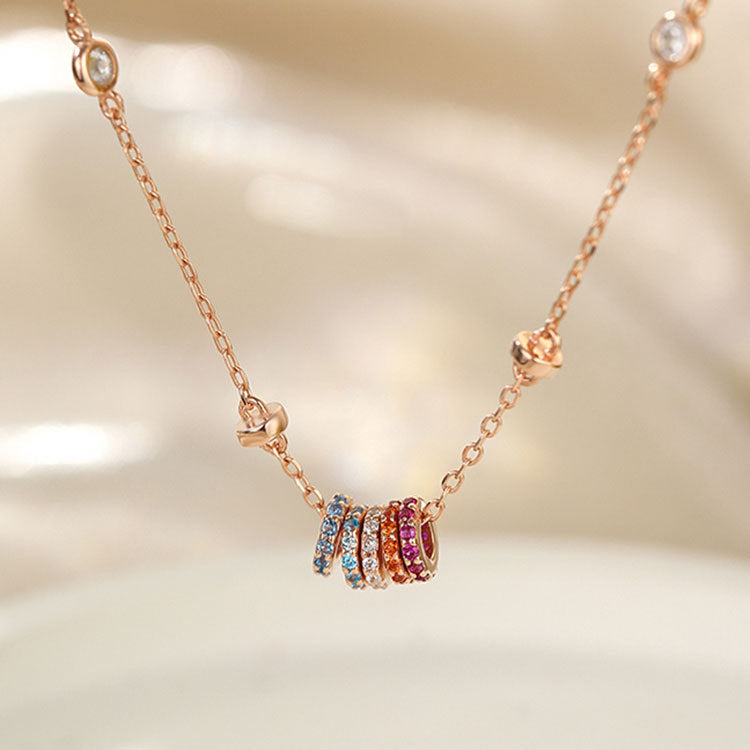 Rose gold version of the rainbow zircon charm necklace