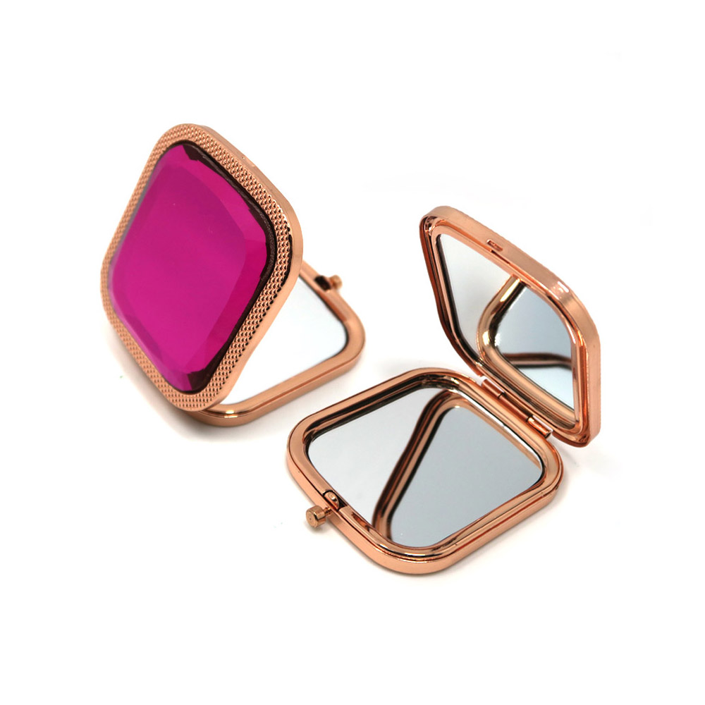 Two styles of rose gold compact mirrors with crystal gemstone covers