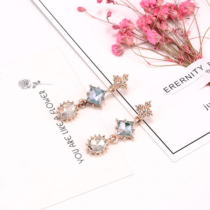 A pair of Sparkly Glass Diamond Geometric Dangle Earrings with rose gold settings