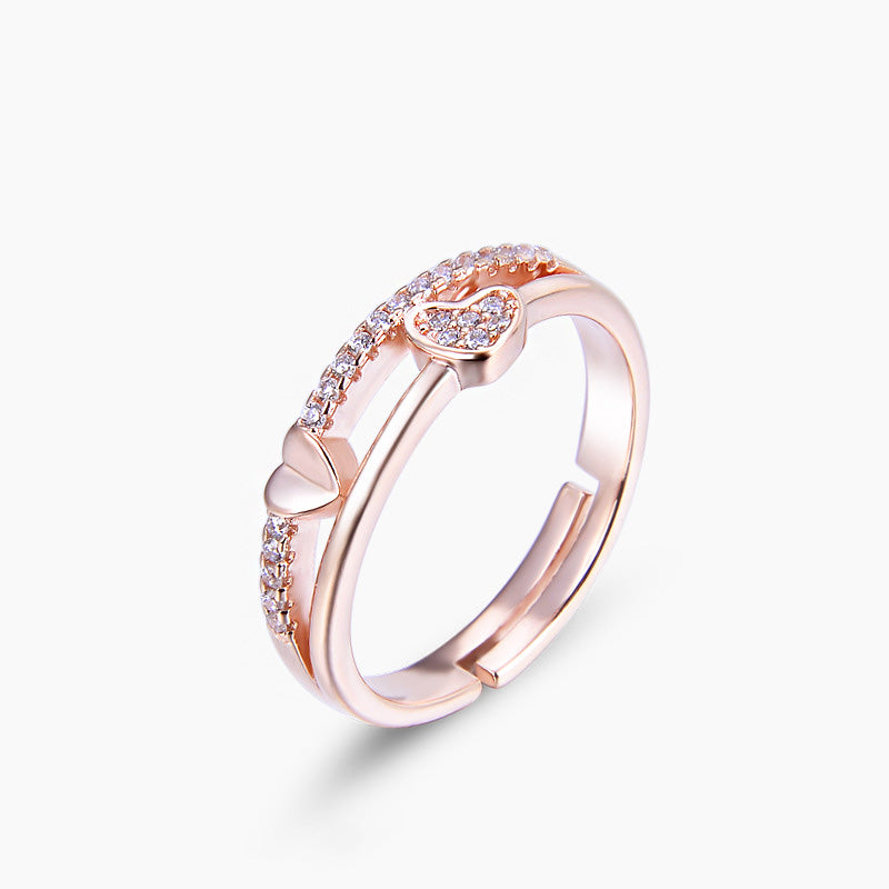 Detailed view of the rose gold heart ring with CZ stones