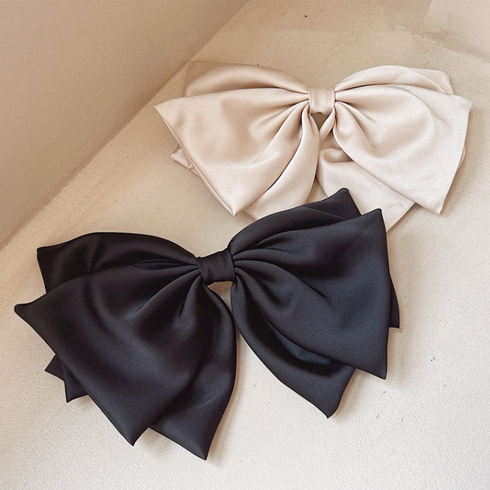 Satin bows in classic black and neutral beige