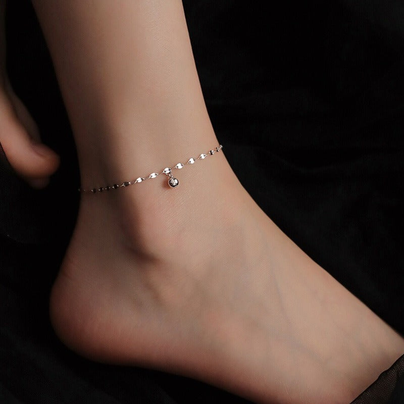 Platinum plated sterling silver cat anklet on a white background