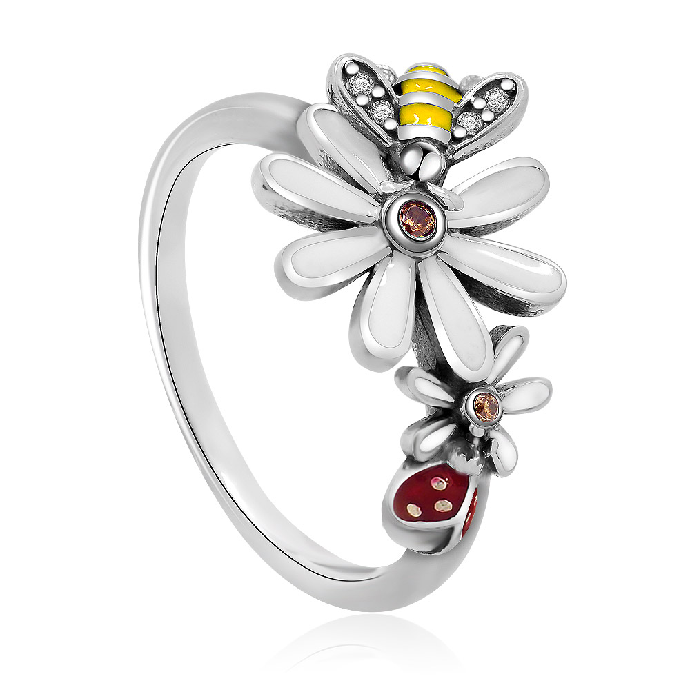 A close-up of the bee and flower design on the sterling silver ring, showcasing the intricate details and gemstone settings.