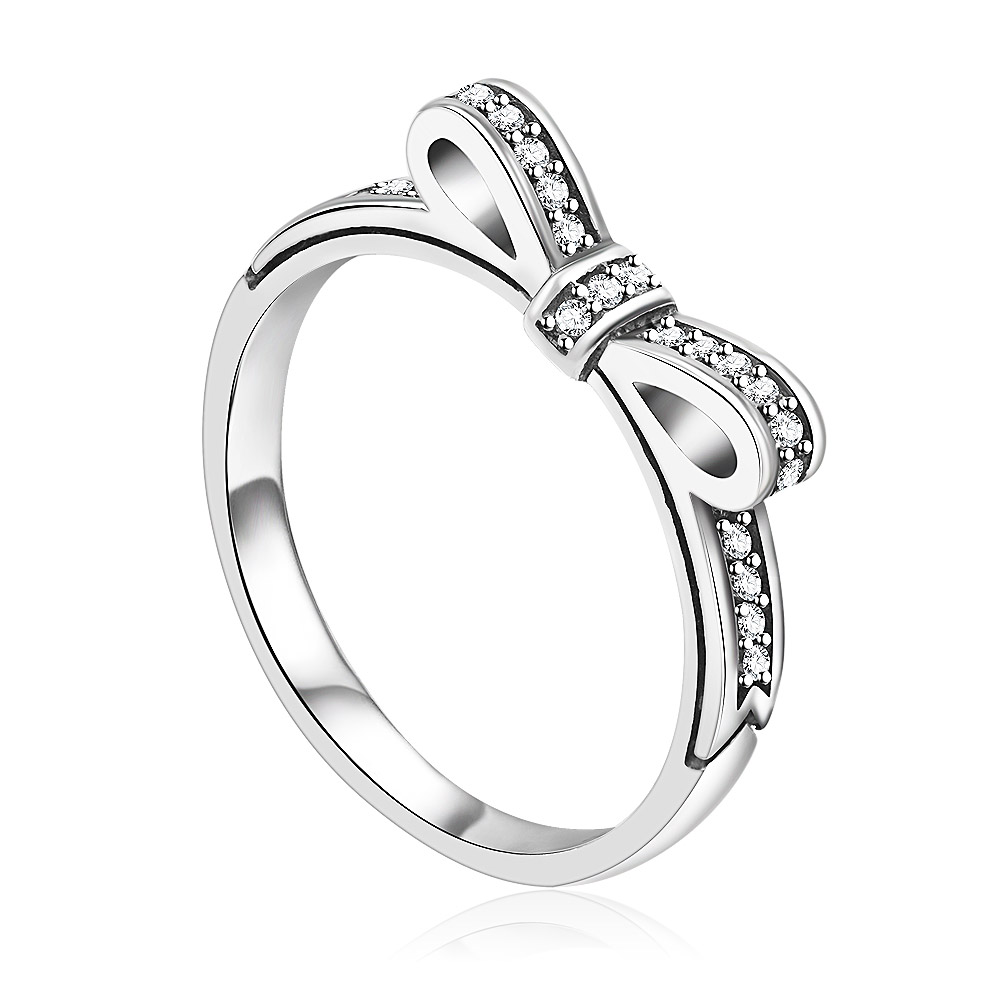 Detailed view of the S925 Silver Bow Knot Ring on a reflective surface