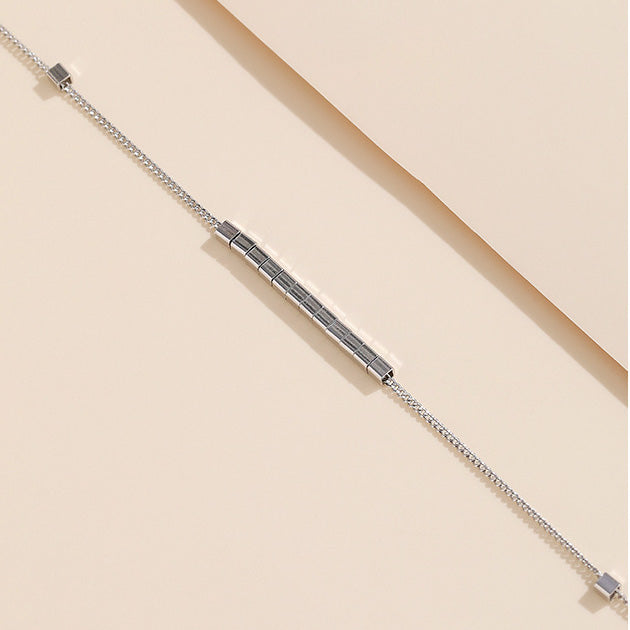 Detailed view of the sterling silver bracelet's grid pattern