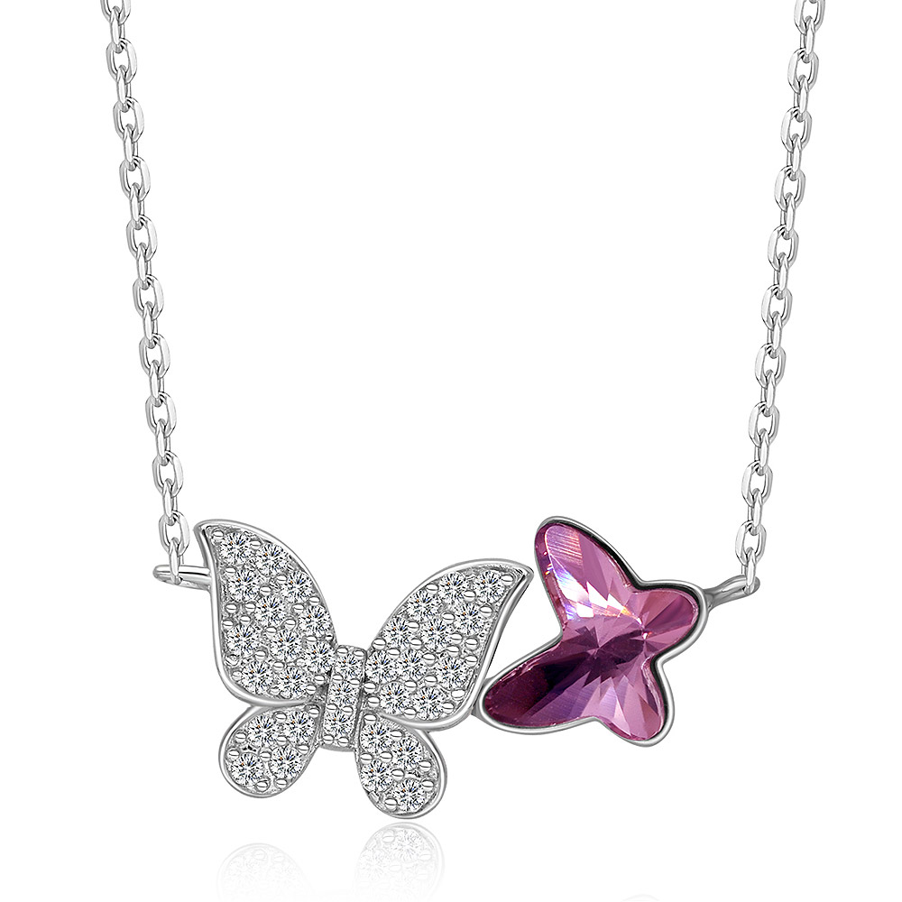 A model wearing the twin butterfly pendant necklace with pink Swarovski crystal