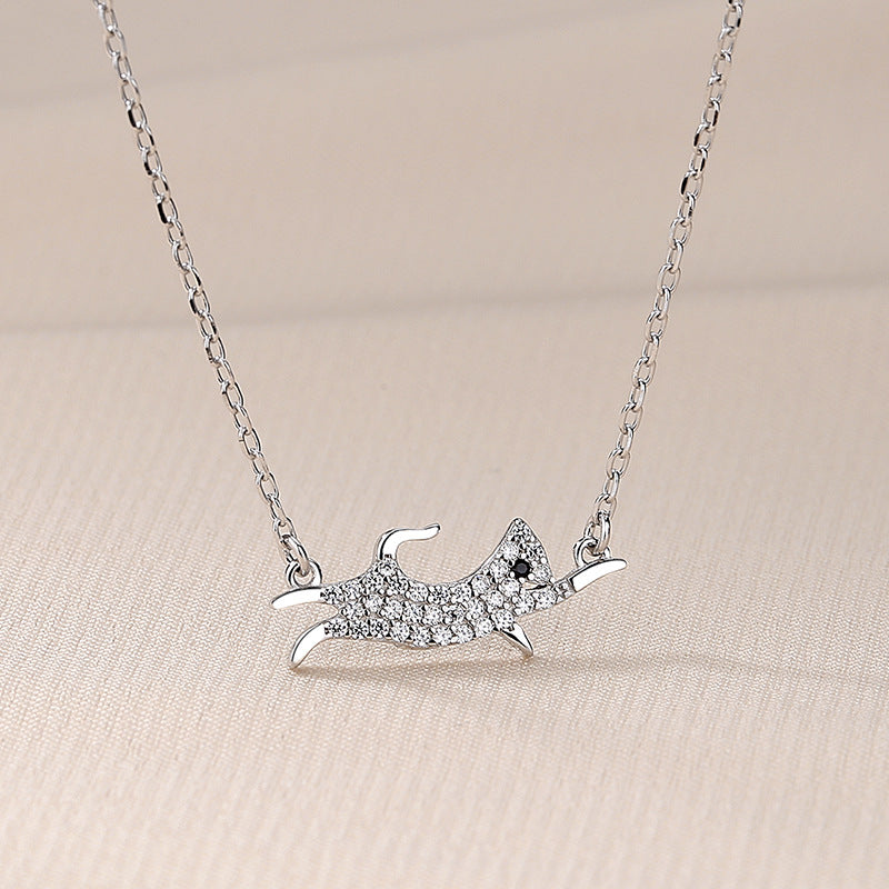Close-up of the sterling silver dog pendant with CZ stones