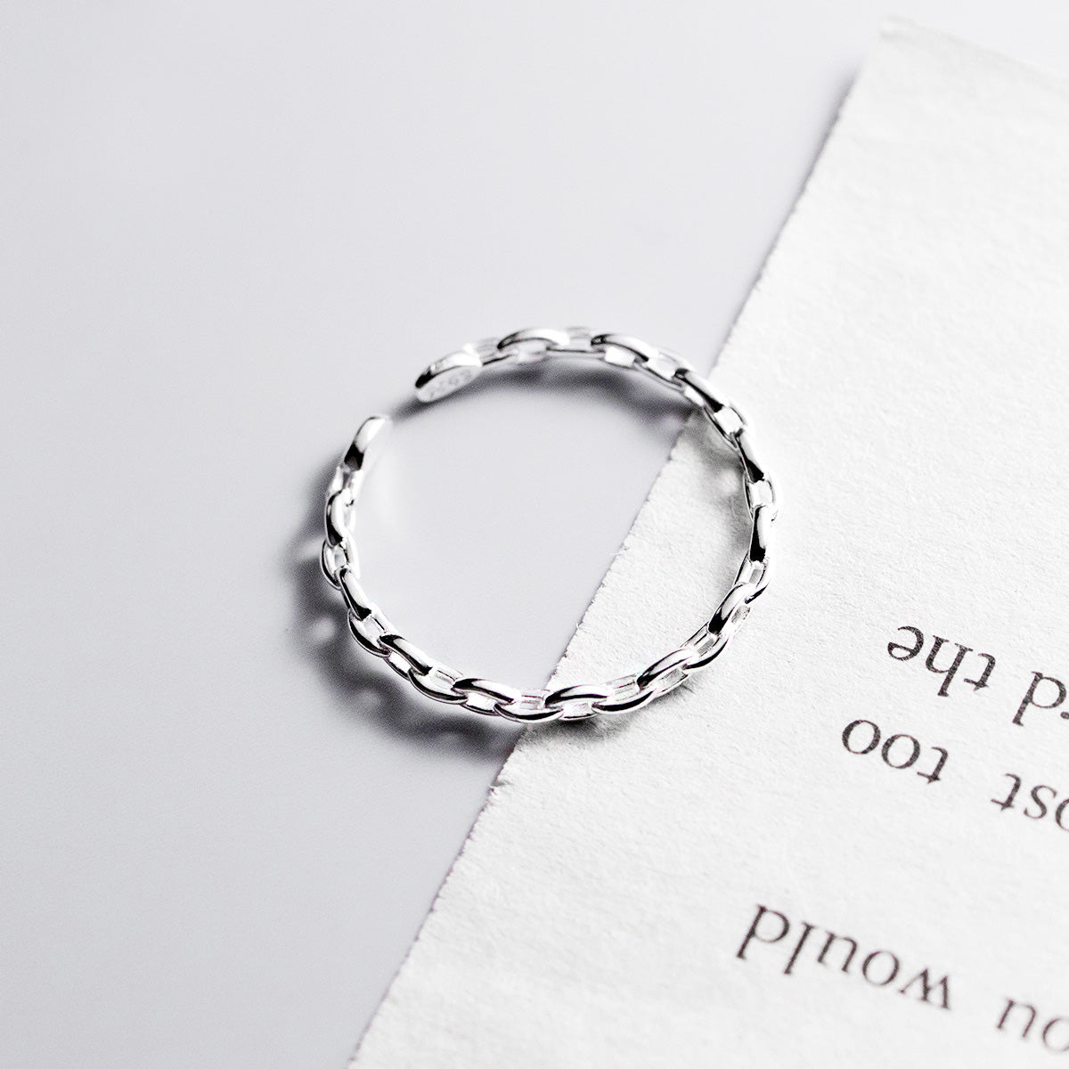 Detailed view of the 925 sterling silver link chain ring design.