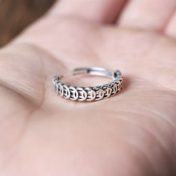 A model wearing one of the sterling silver adjustable rings to showcase its fit and style.