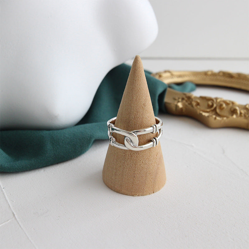 Detailed product shot of a sterling silver chain ring from the minimalist set.