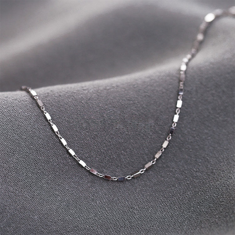 Close-up of the sterling silver square geometry chain bracelet