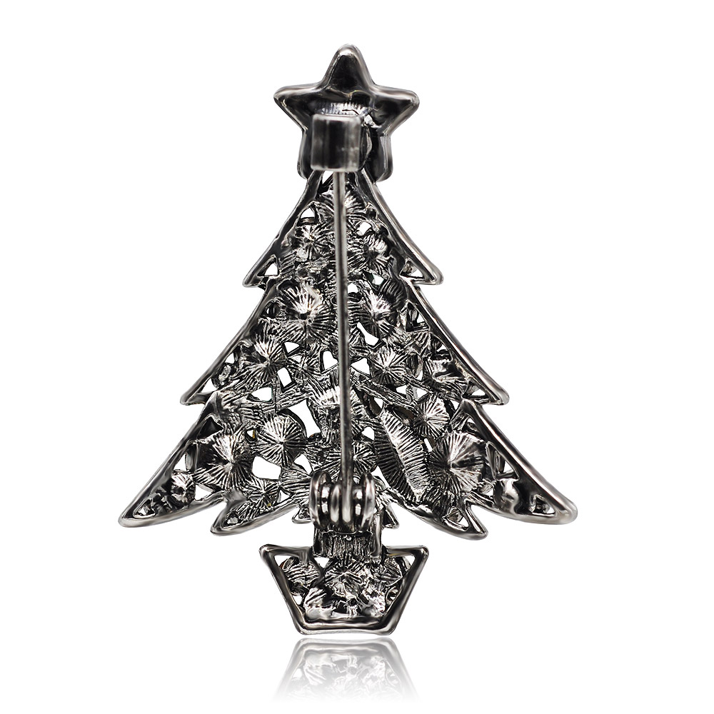 Detailed view of the Christmas tree brooch's intricate metalwork and finish