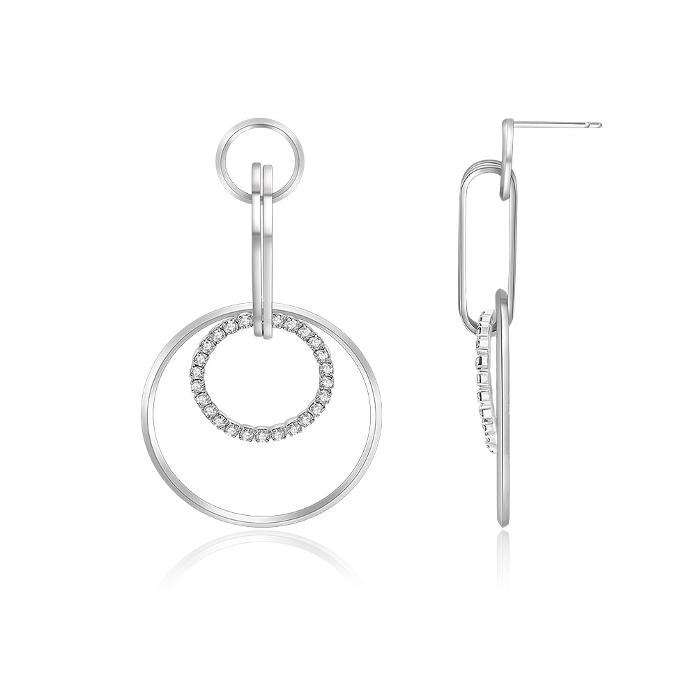 Detailed view of the rhodium-plated circle earrings with crystal fittings