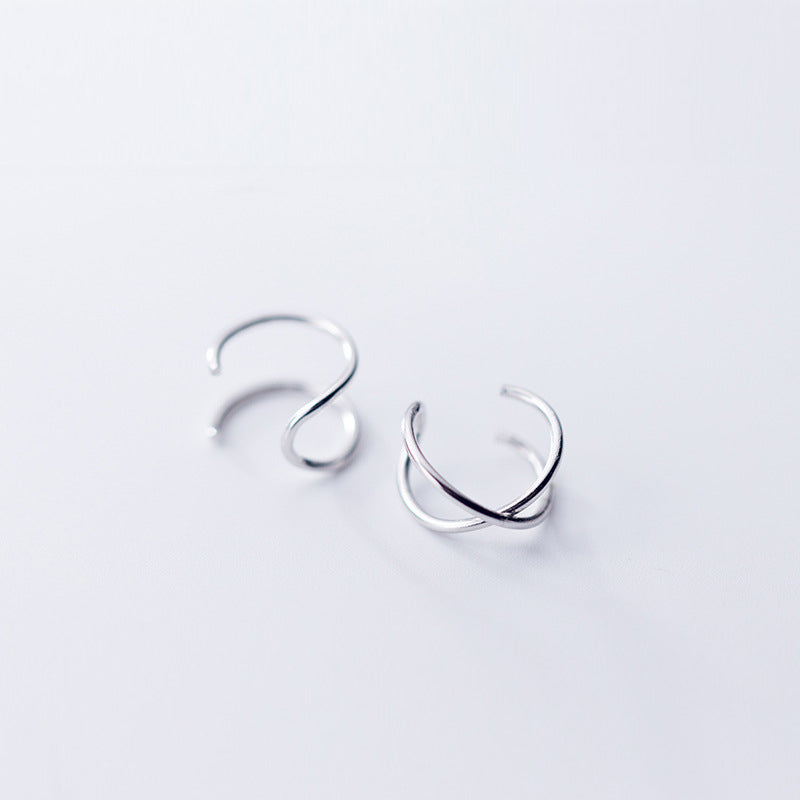 A pair of minimalist 925 sterling silver curved cuff earrings