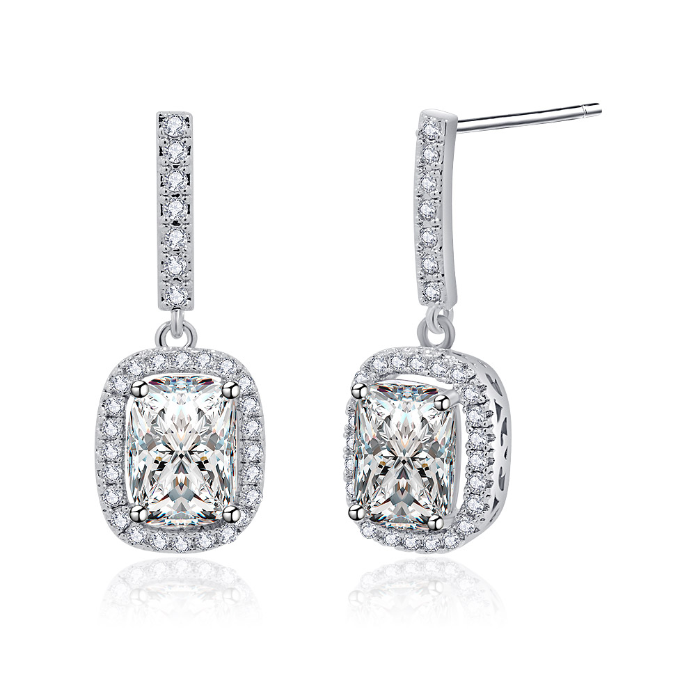 Detailed view of the emerald-cut CZ stone on the dangle earrings