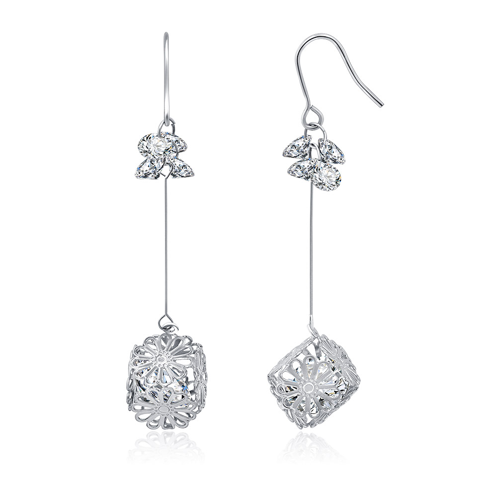 Detailed view of the Daisy Drop earrings' filigree design