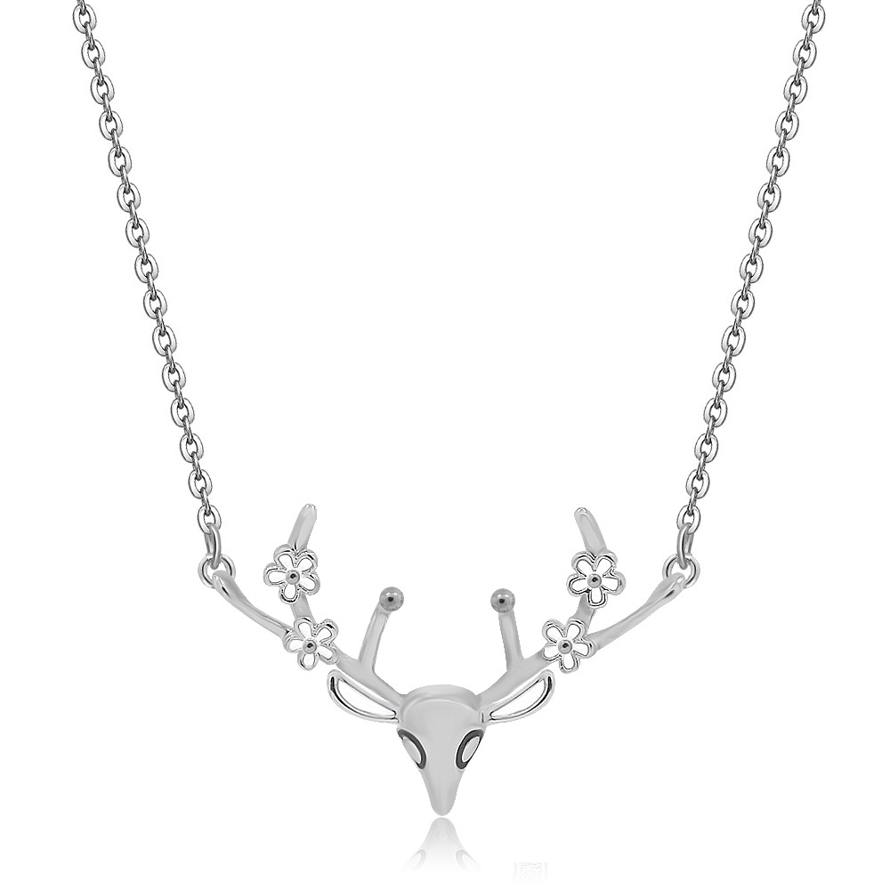 Detailed view of the deer antler pendant with floral accents