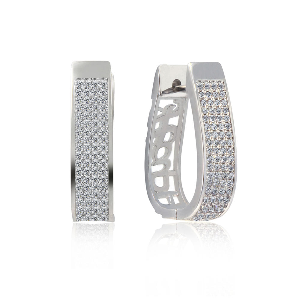 Detailed side view of the Large Oval CZ Huggie earrings