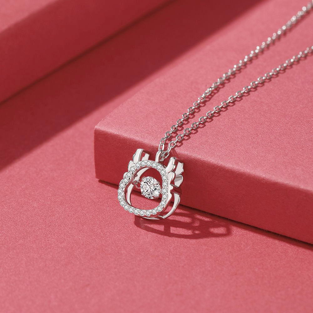 Close-up of the spinning CZ stone on the silver dragon necklace