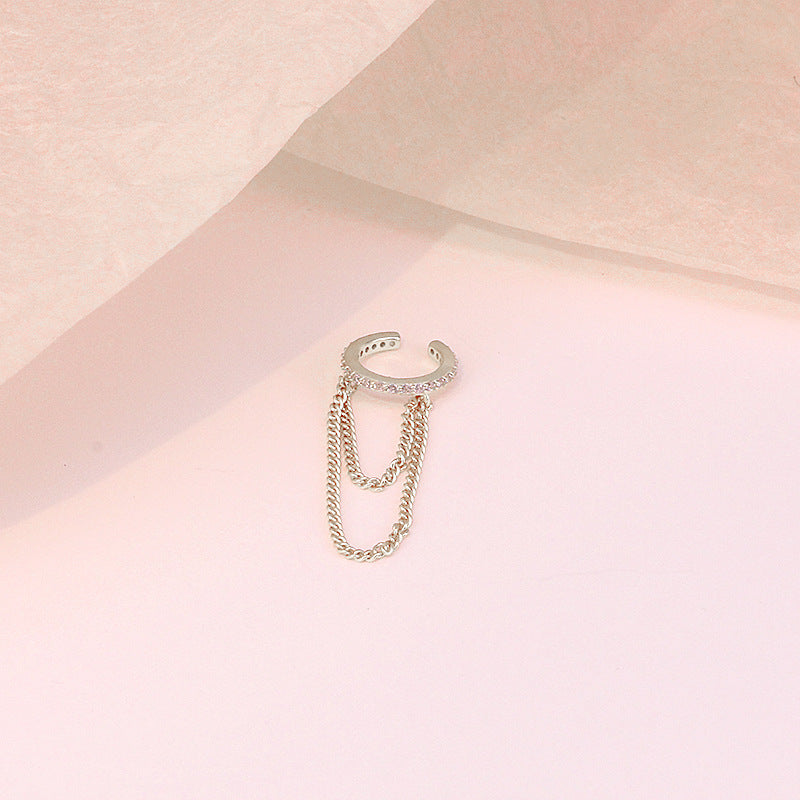 A detailed macro shot of the sterling silver chain tassel earring's craftsmanship.