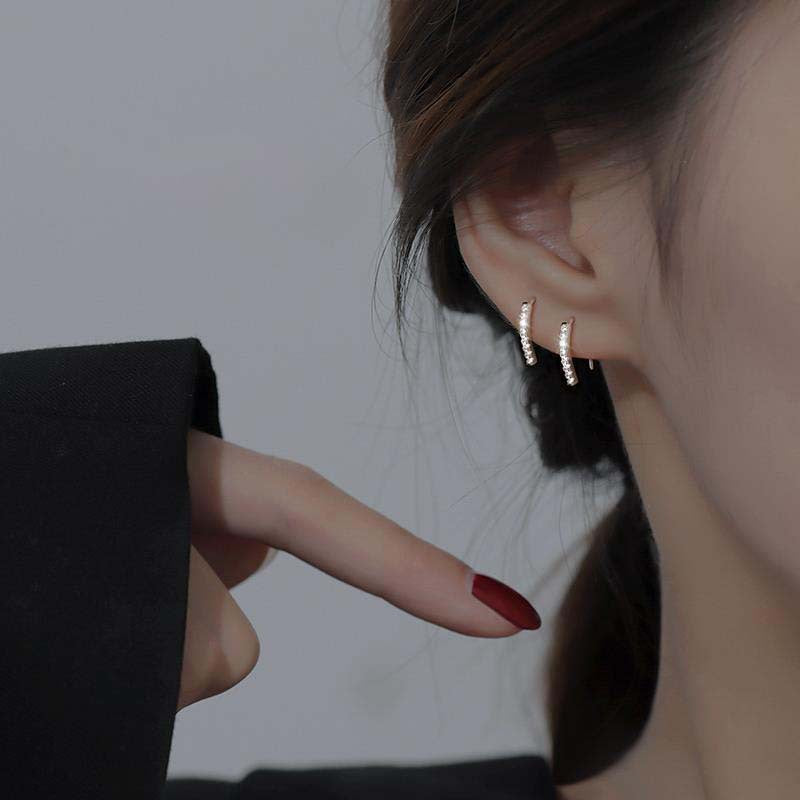Detailed close-up of the pavé setting on the sterling silver earrings