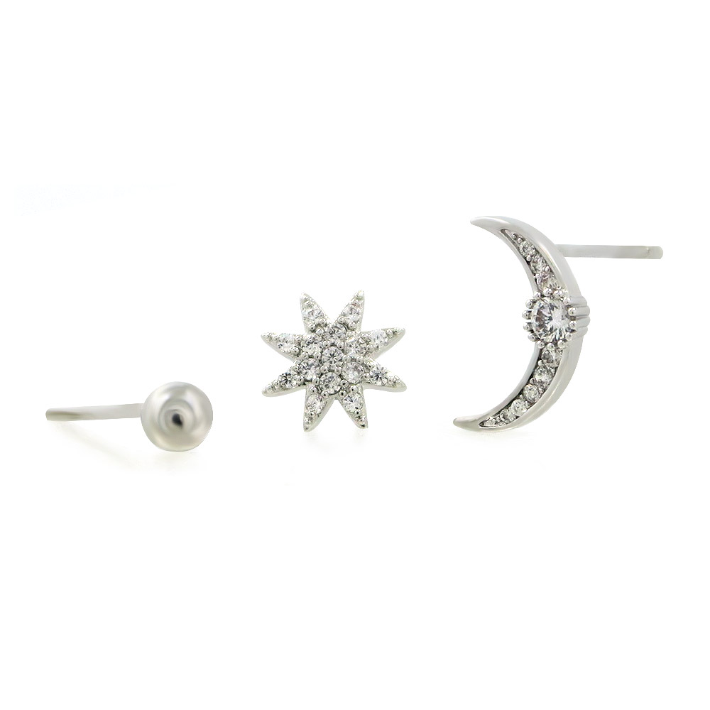 The three-pair set of star, moon, and ball stud earrings on a presentation card