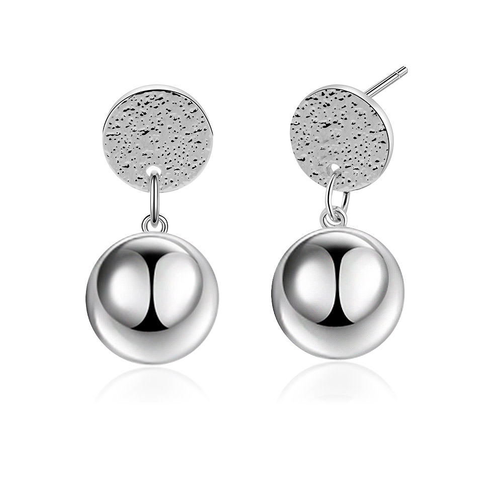Detailed view of the textured and polished surfaces of the earrings