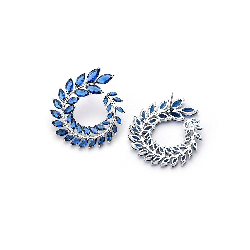 A detailed view of the Blue Marquise Cluster Earrings' gemstone setting
