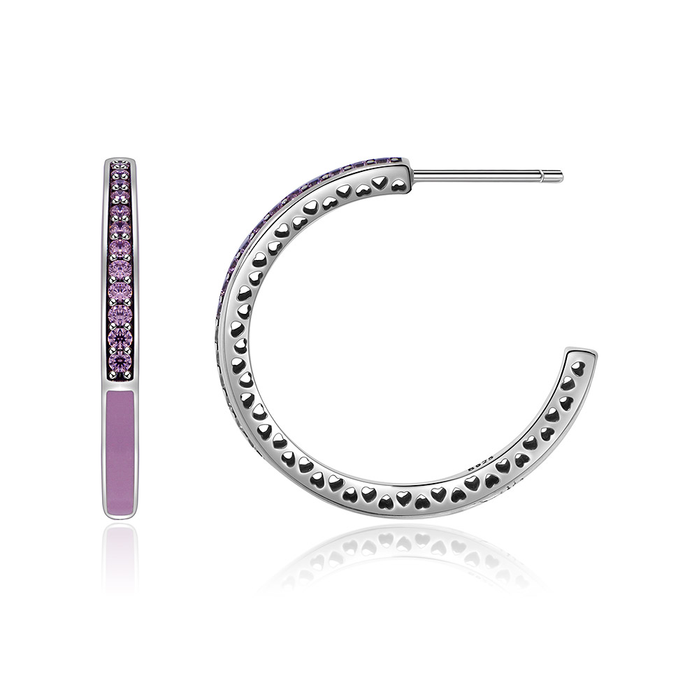 Detailed view of the pink epoxy huggie hoop earring's craftsmanship