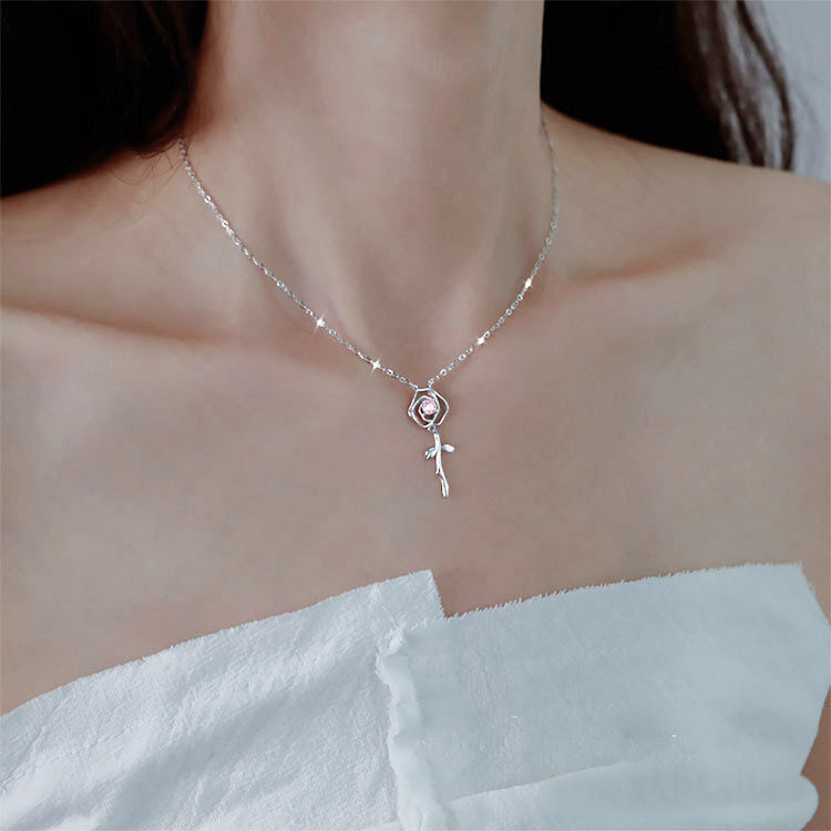 Model showcasing the elegant 925 silver rose flower pendant necklace.
