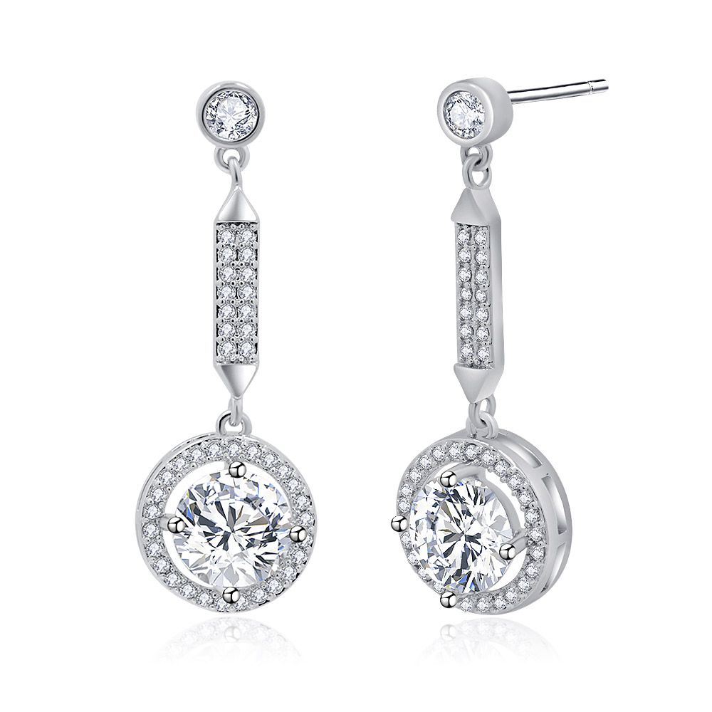 A close-up of the Twilight Sparkling CZ Halo Round Earrings on a reflective surface.