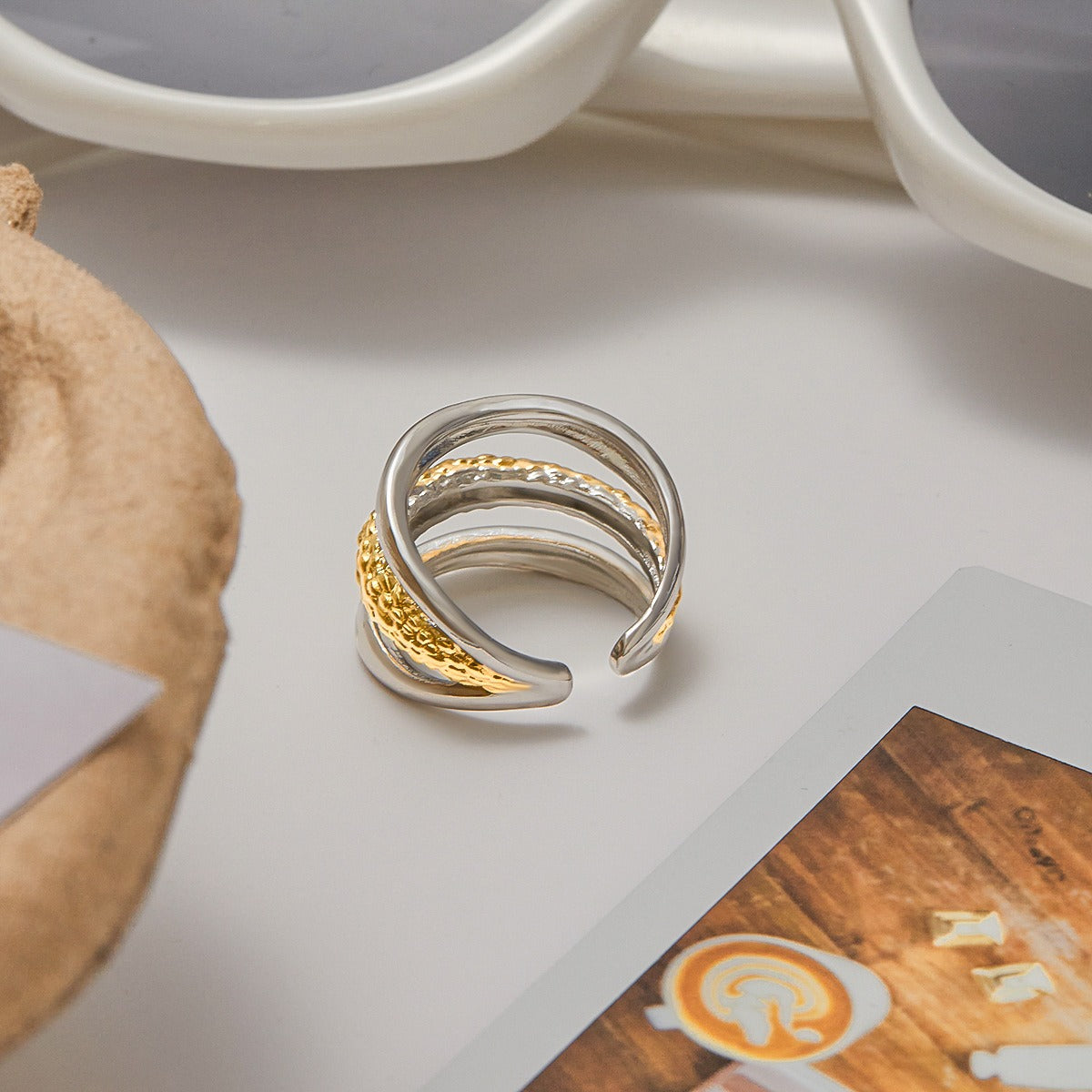 A close-up of the two-tone stainless steel ring showcasing its layered design and mixed metal finish.