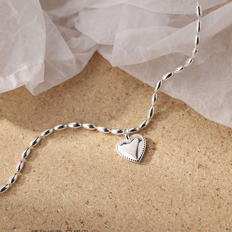 Clean product shot of the 925 sterling silver heart pendant bracelet
