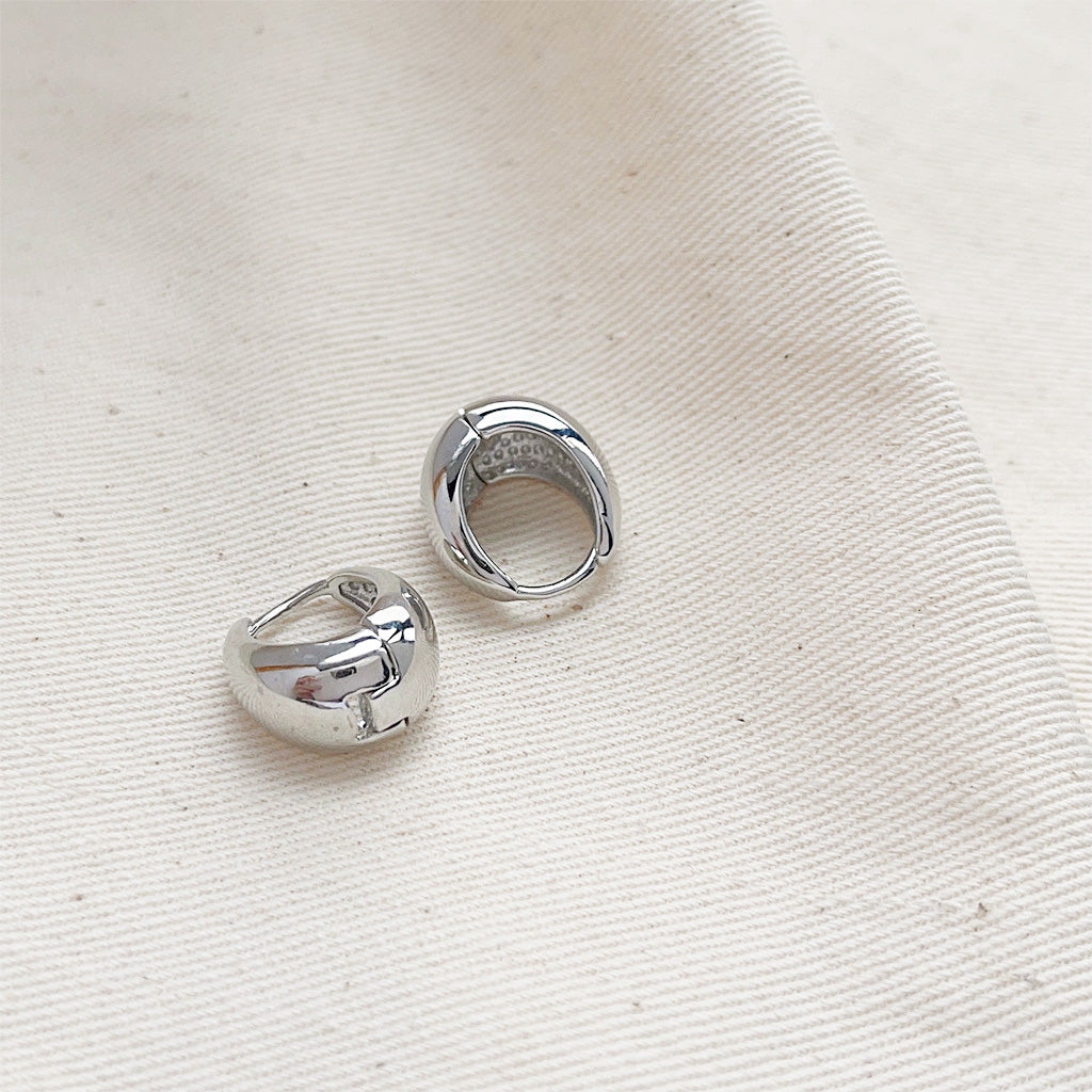 Detailed view of the silver-finished teardrop hoop earrings