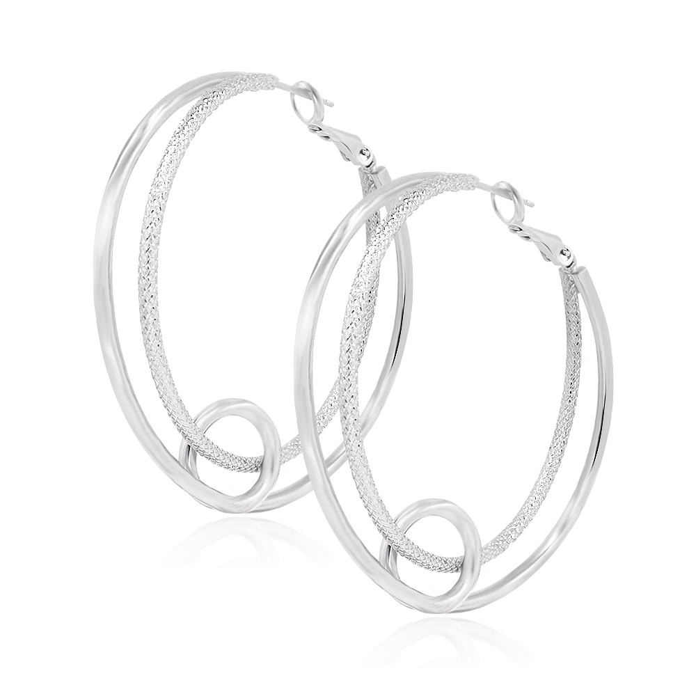 Detailed view of the textured inner hoop of the silver earrings