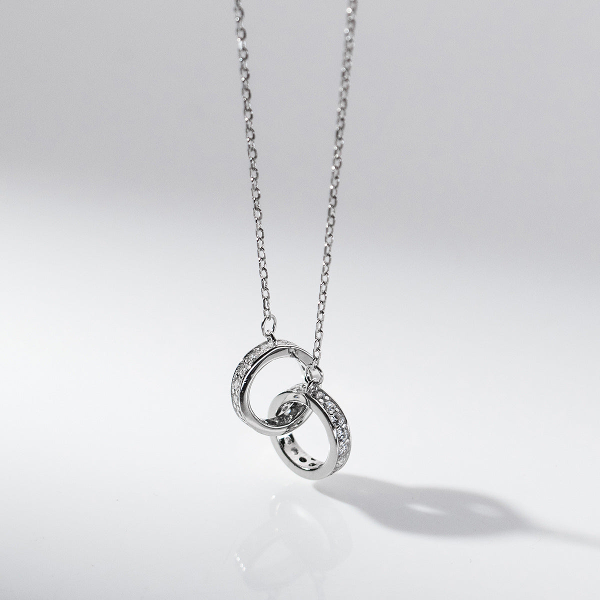 Detailed close-up of the 925 sterling silver interlocking circle pendant