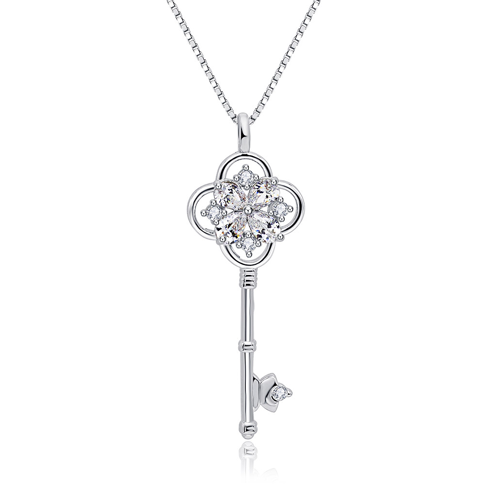 Detailed view of the key pendant's flower-like design