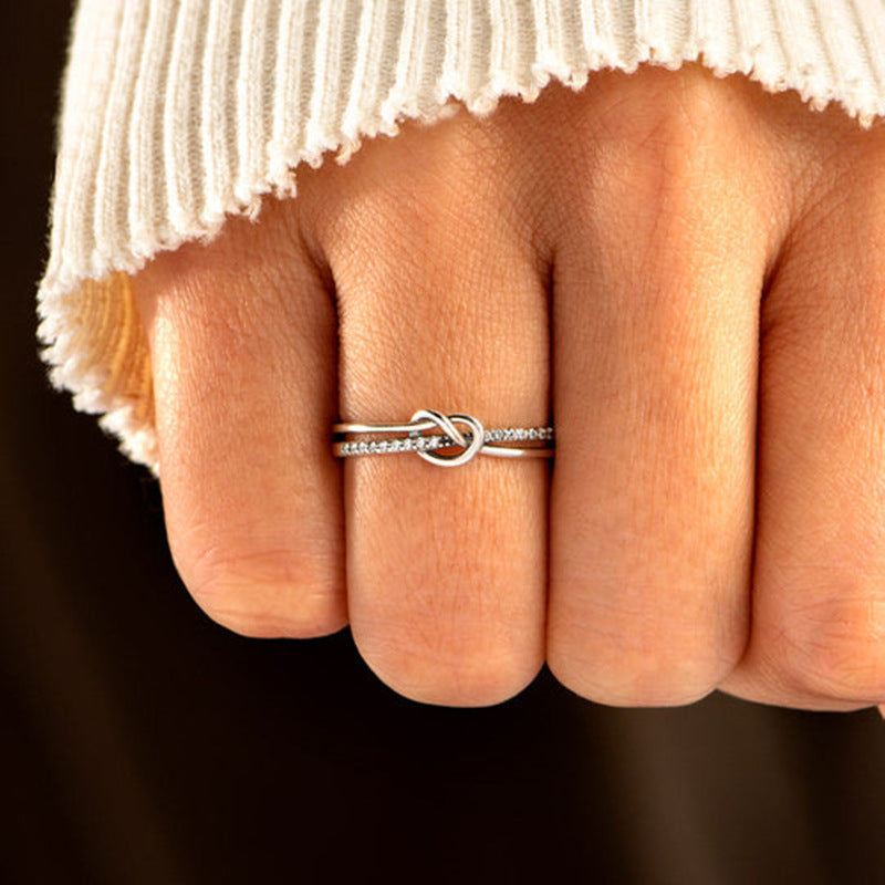Model wearing the Eternal Bond silver knot ring to showcase its elegant fit.