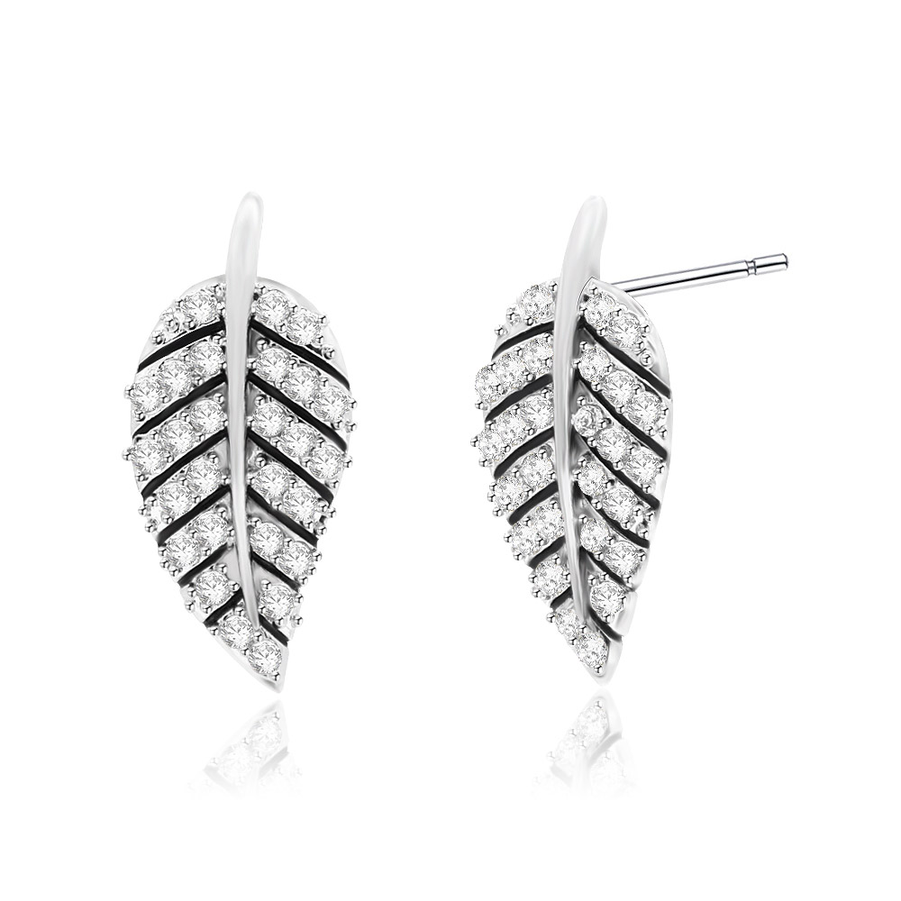 Detailed view of the leaf earring's pave setting and vein design
