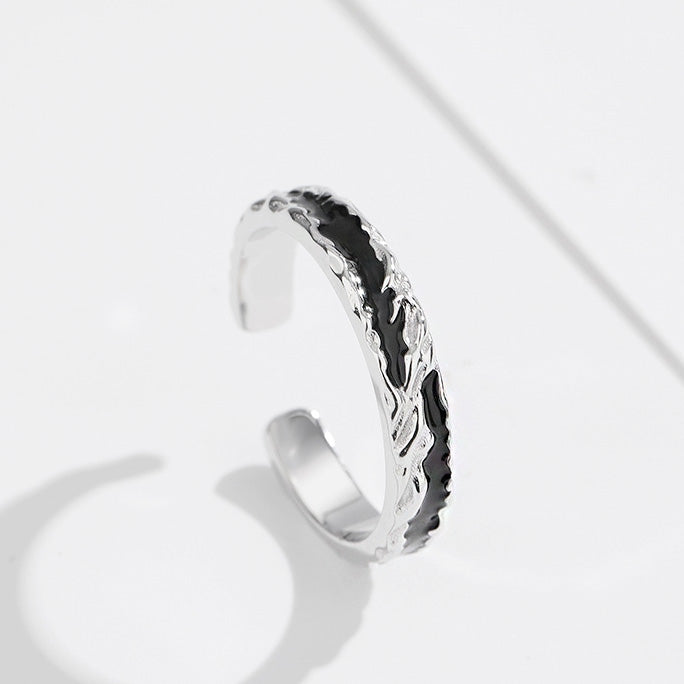 A sterling silver open ring with an intricate leaf pattern, part of the 10-piece men's ring set.