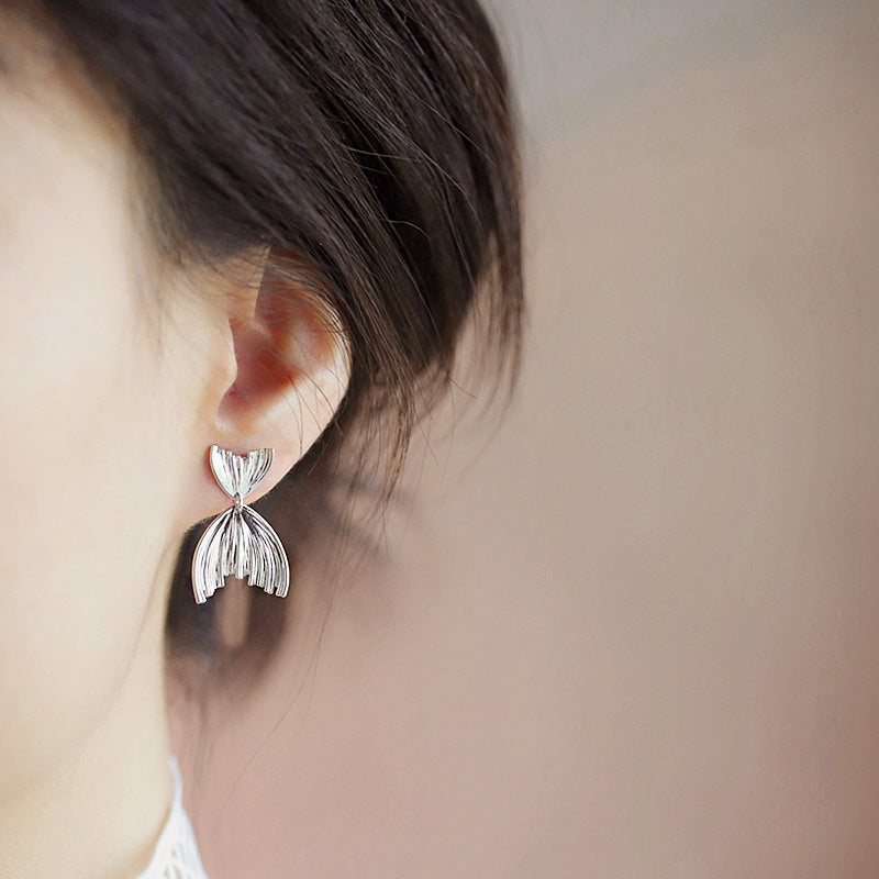 Model showcasing the mermaid tail earring