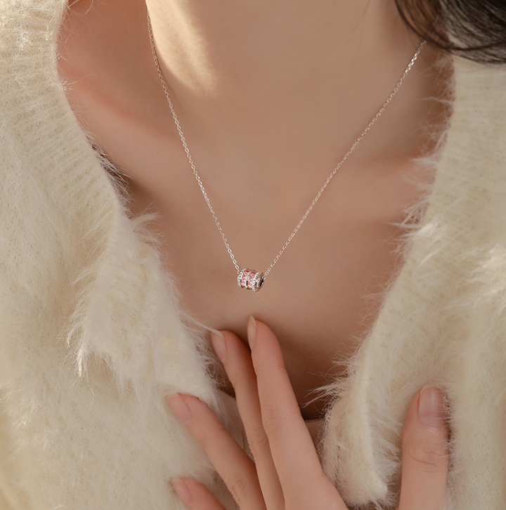 Model wearing the 925 Sterling Silver Round Charm Pendant with a clear cubic zirconia stone.
