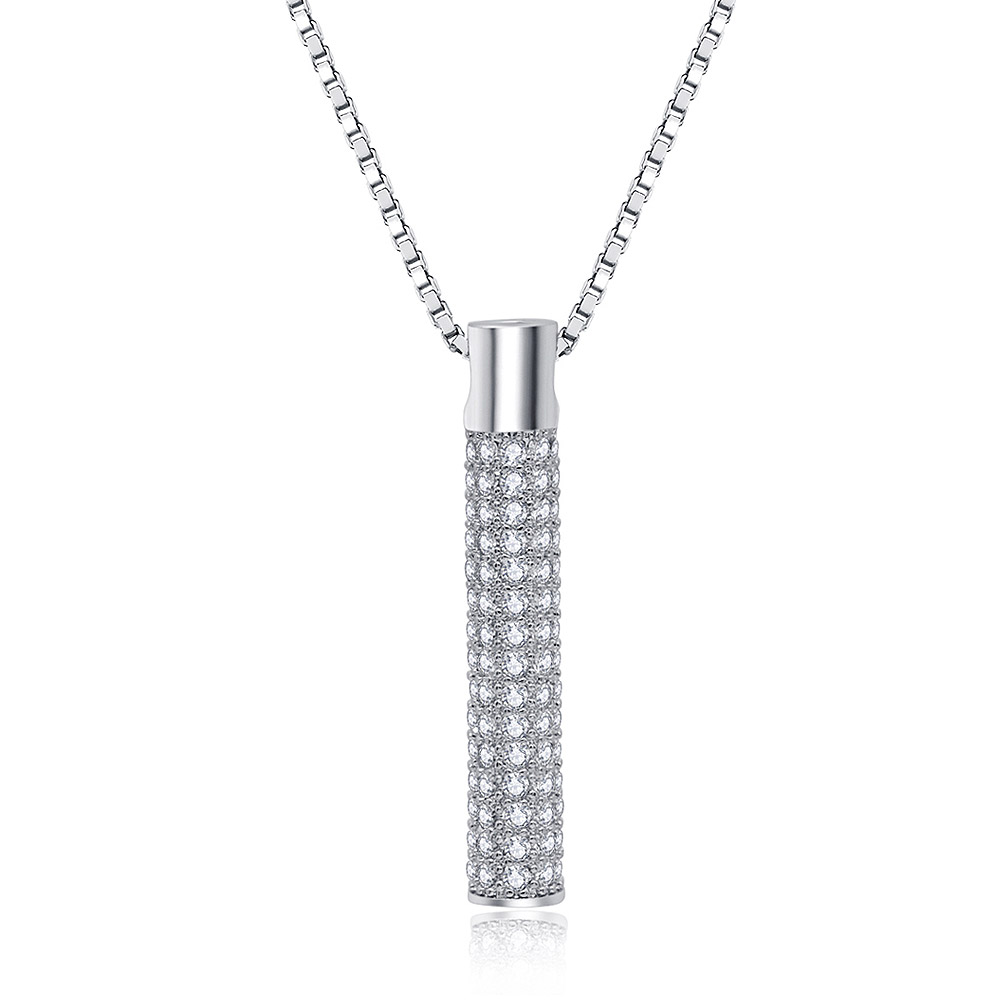 A detailed shot of the vertical CZ bar pendant on its chain
