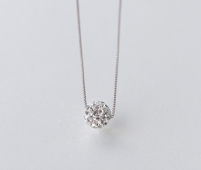 Close-up of the CZ ball pendant and silver chain