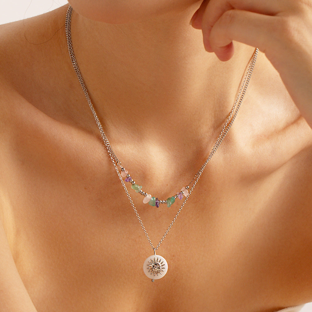 Model wearing the layered stainless steel beach style necklaces