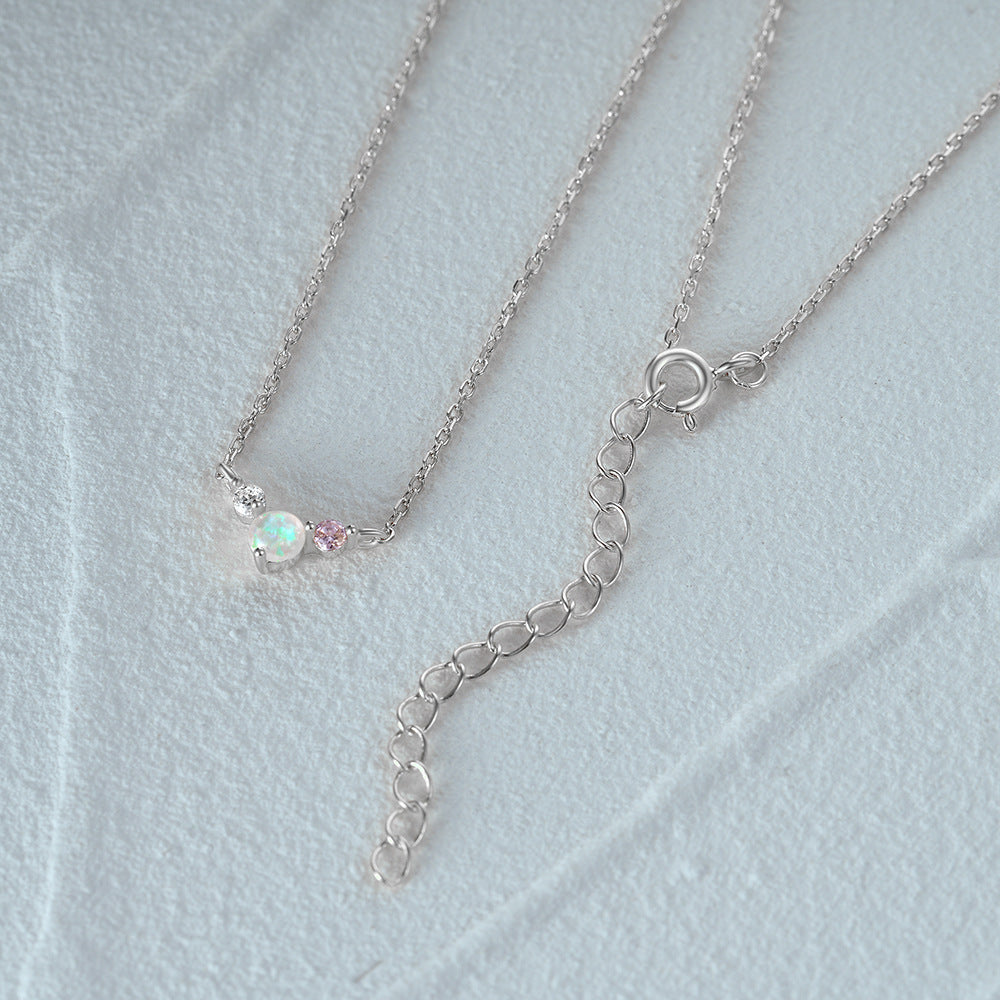 A pair of 925 sterling silver necklaces with opal and CZ pendants