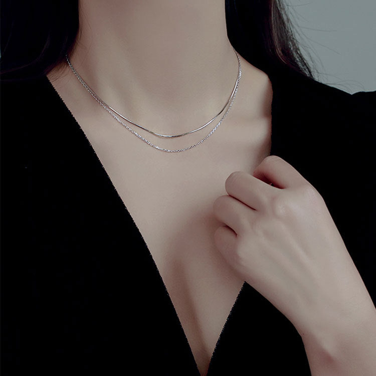Model wearing the 925 Silver Double Layer Snake and Link Chain Necklace