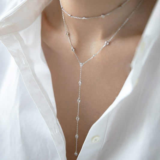 Model wearing layered 925 sterling silver necklaces from JR Fashion Accessories