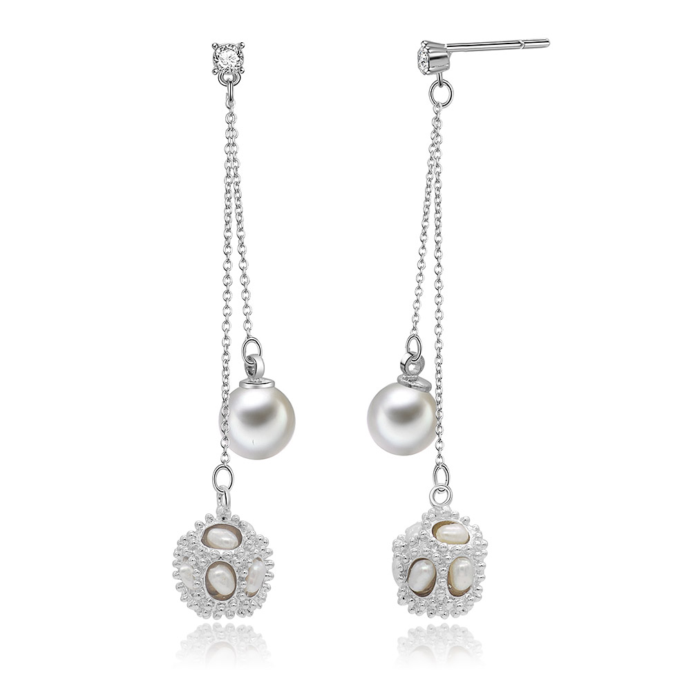 A close-up view of the Chandelier Pearls Dangling Earrings highlighting the gemstone details